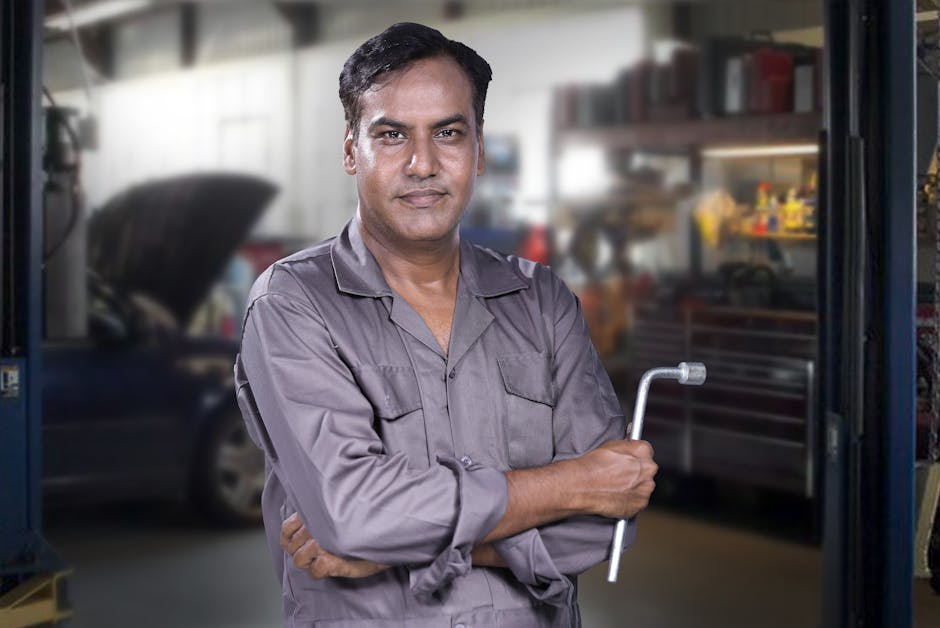 Friendly auto glass repair mechanic ready to service a vehicle