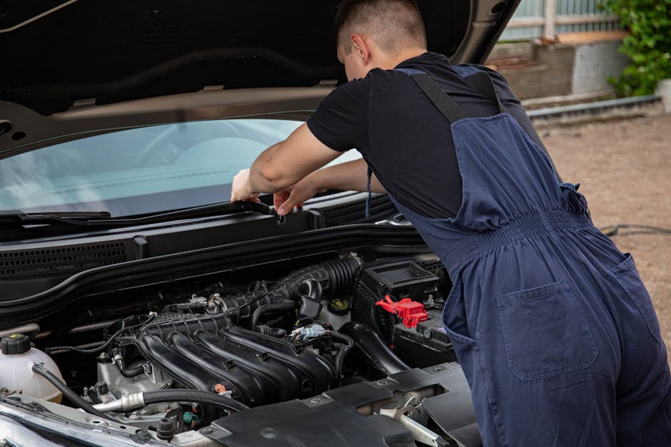 Mechanic carefully fixing and replacing a side car window